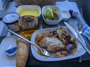 Lunch, served shortly after our 1:20PM departure, was chicken under bacon bits, with tiny potatoes.
