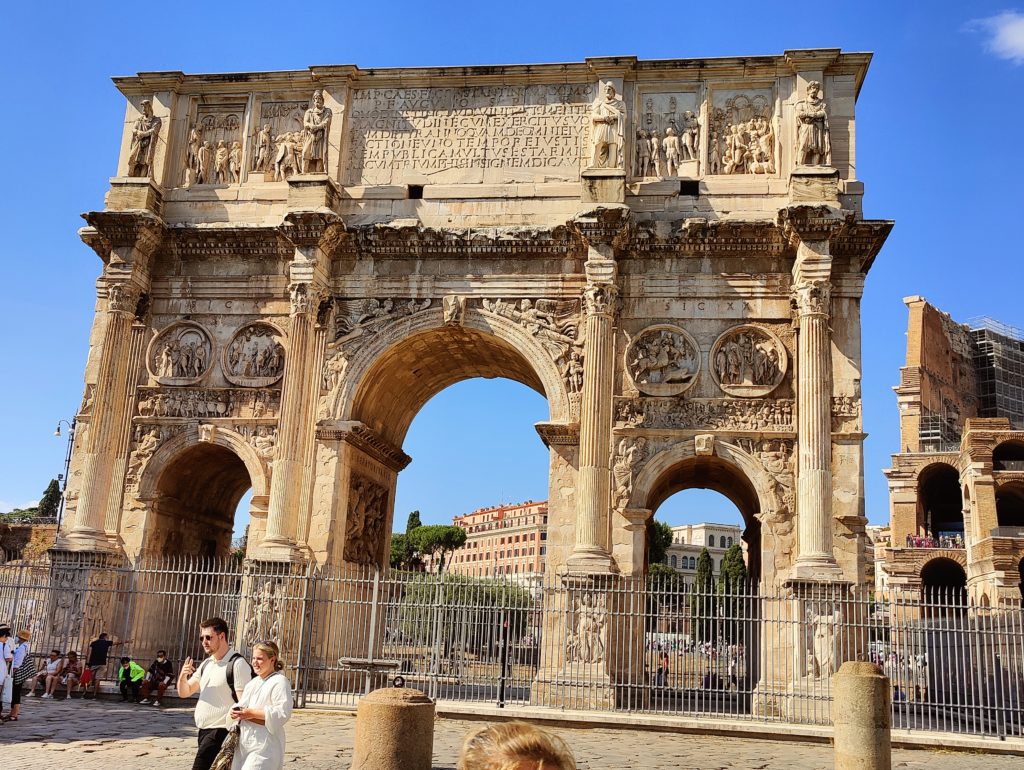 An ornate arch, or rather a large arch flanked by two smaller ones.