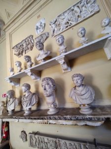 Busts of Roman emperors lined up on two long shelves