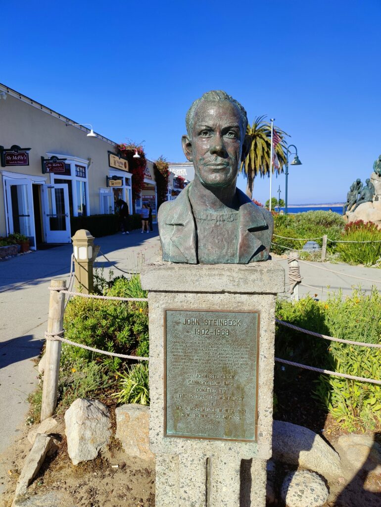 The bronze plaque on the bust's pedestal says "John Steinbeck 1902-1968"